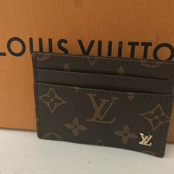 Louis Vuitton leather mini pouch with Gold raised LV - Picture 1 of 4